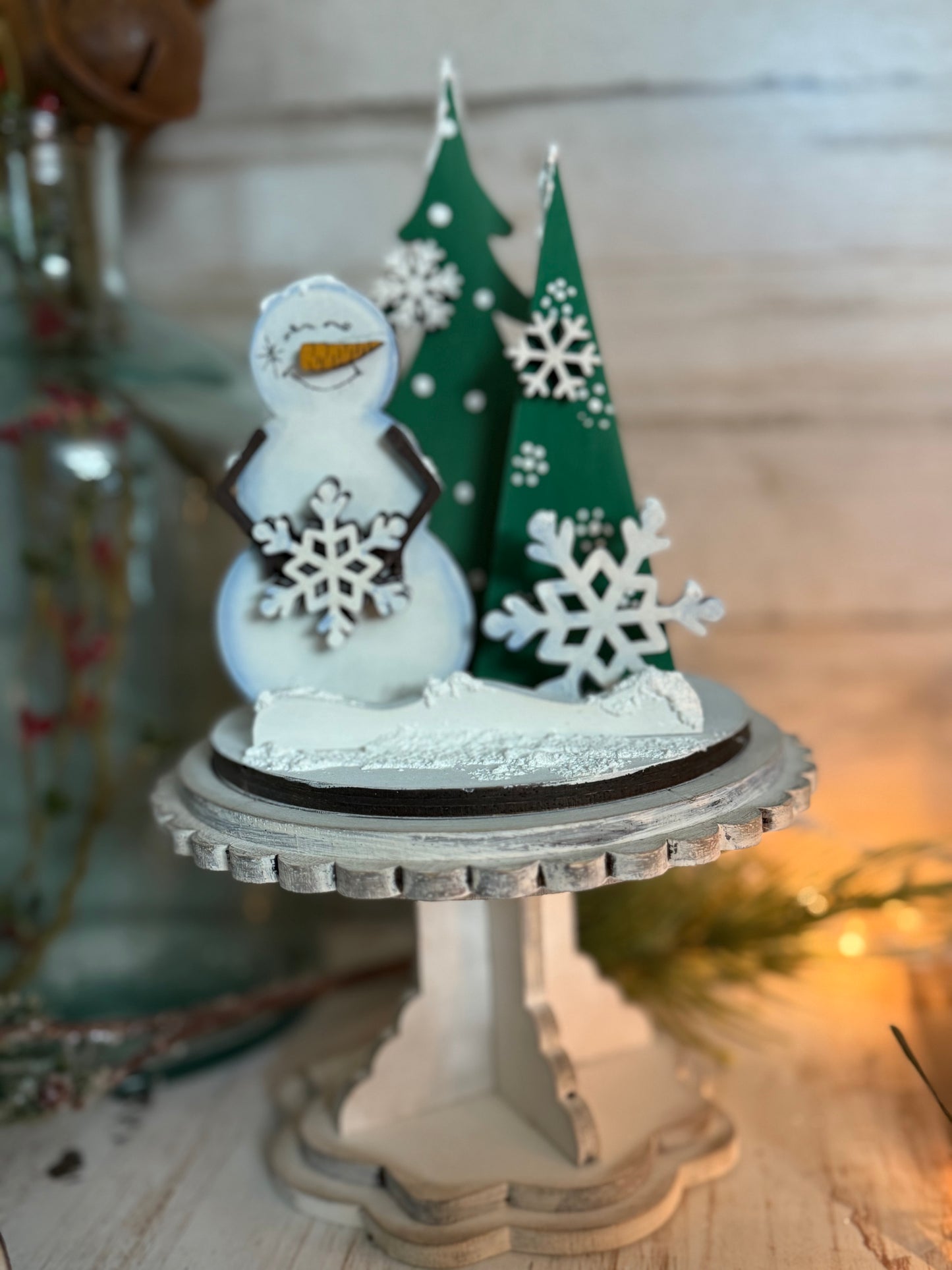 Small pedestal Snowman and trees