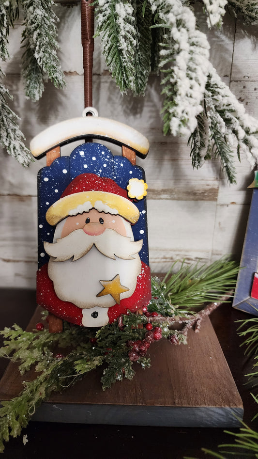 Santa sled Christmas Ornament