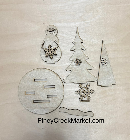 Small pedestal Snowman and trees