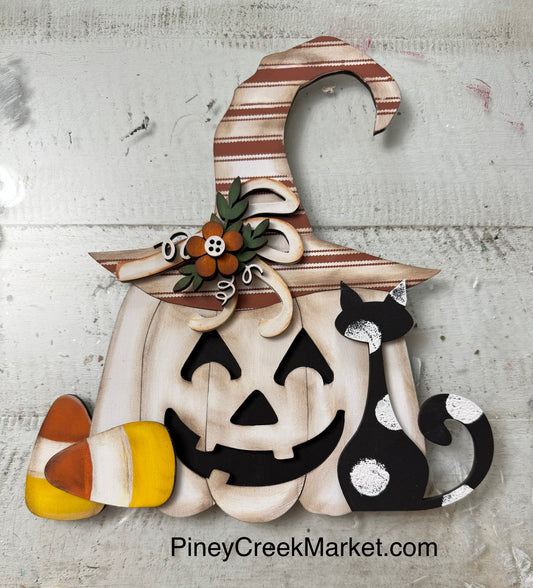 Pumpkin with cat and witch’s hat